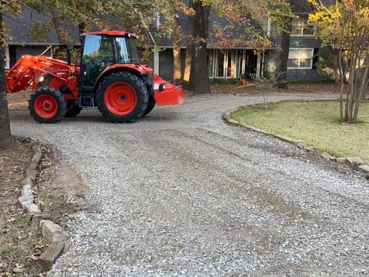 driveway with new rock and tractor